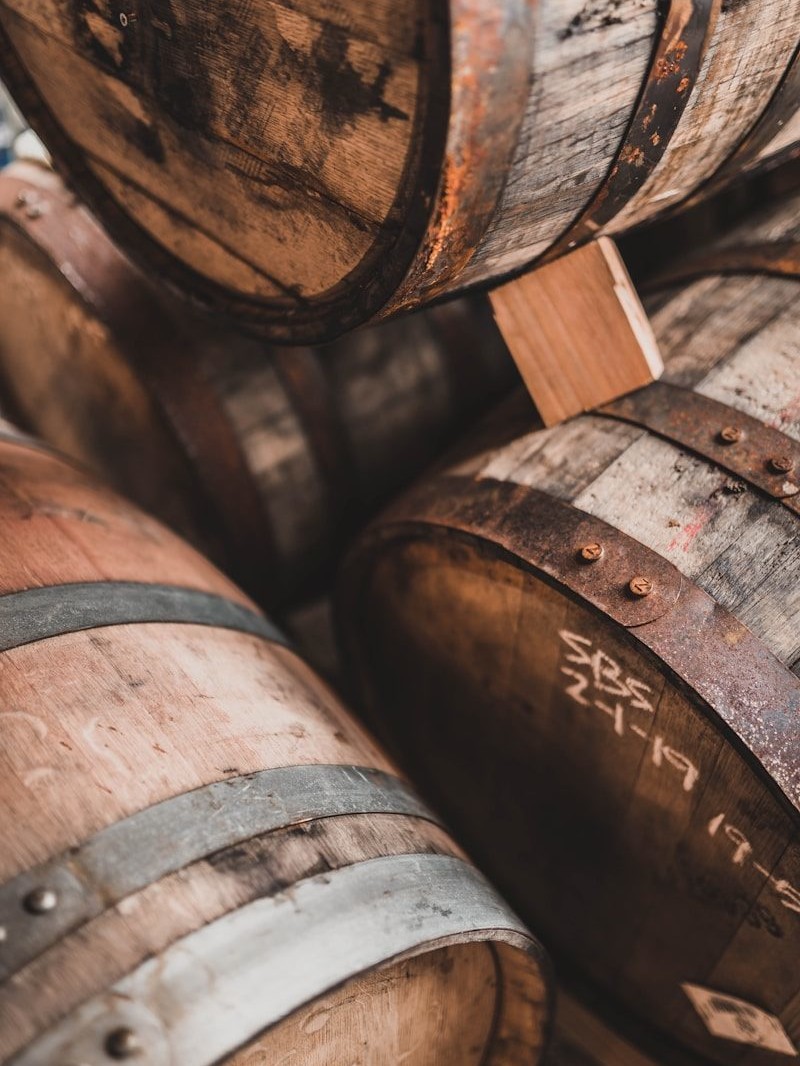 brown wooden barrels on brown wooden floor